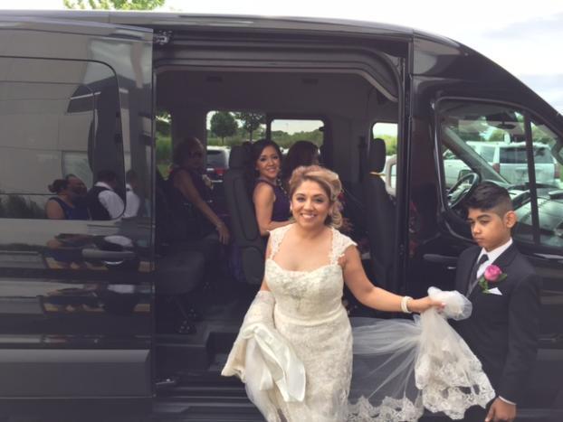 Bride exiting a Stop & Go Airport Shuttle Service, Inc. Sprinter van on her wedding day