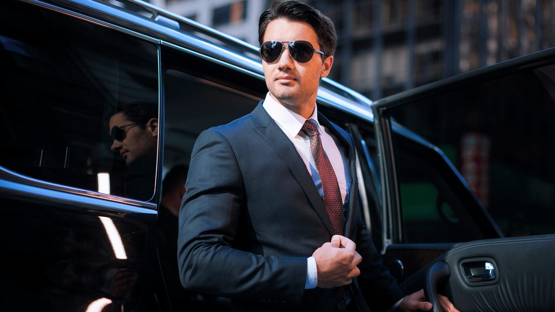 Stop &amp; Go professional chauffeur opening vehicle door for a client in New Lenox