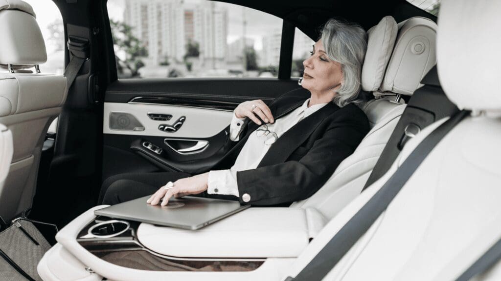 Passenger relaxing in a luxury town car — Stop and Go Airport Shuttle, New Lenox, Illinois
