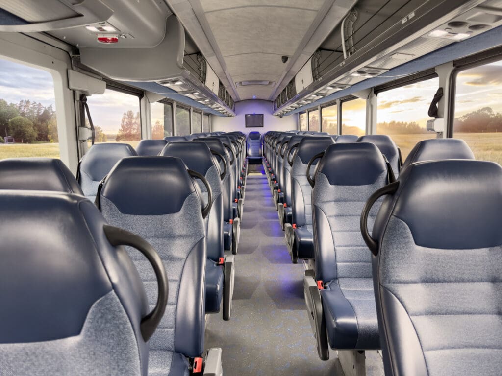 A large party bus with many seats in it